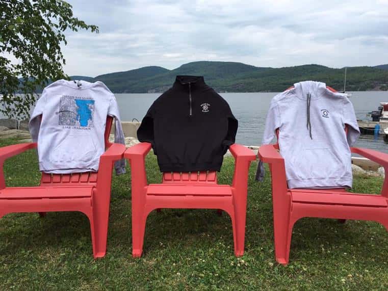 Indian Bay Marina sweatshirts draped over lawn chairs