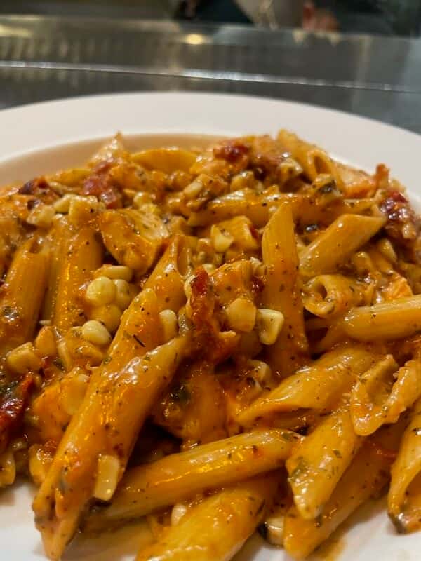 Italian penne pasta, marinated free range chicken breast sauteed, sun-dried tomatoes, sweet corn, chipotle-basil sauce