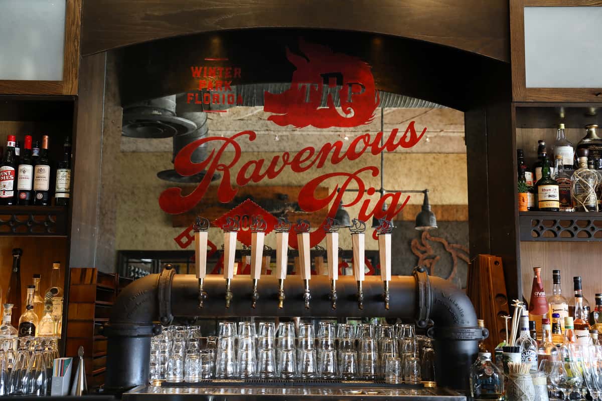 Taproom beer handles with mirror in background