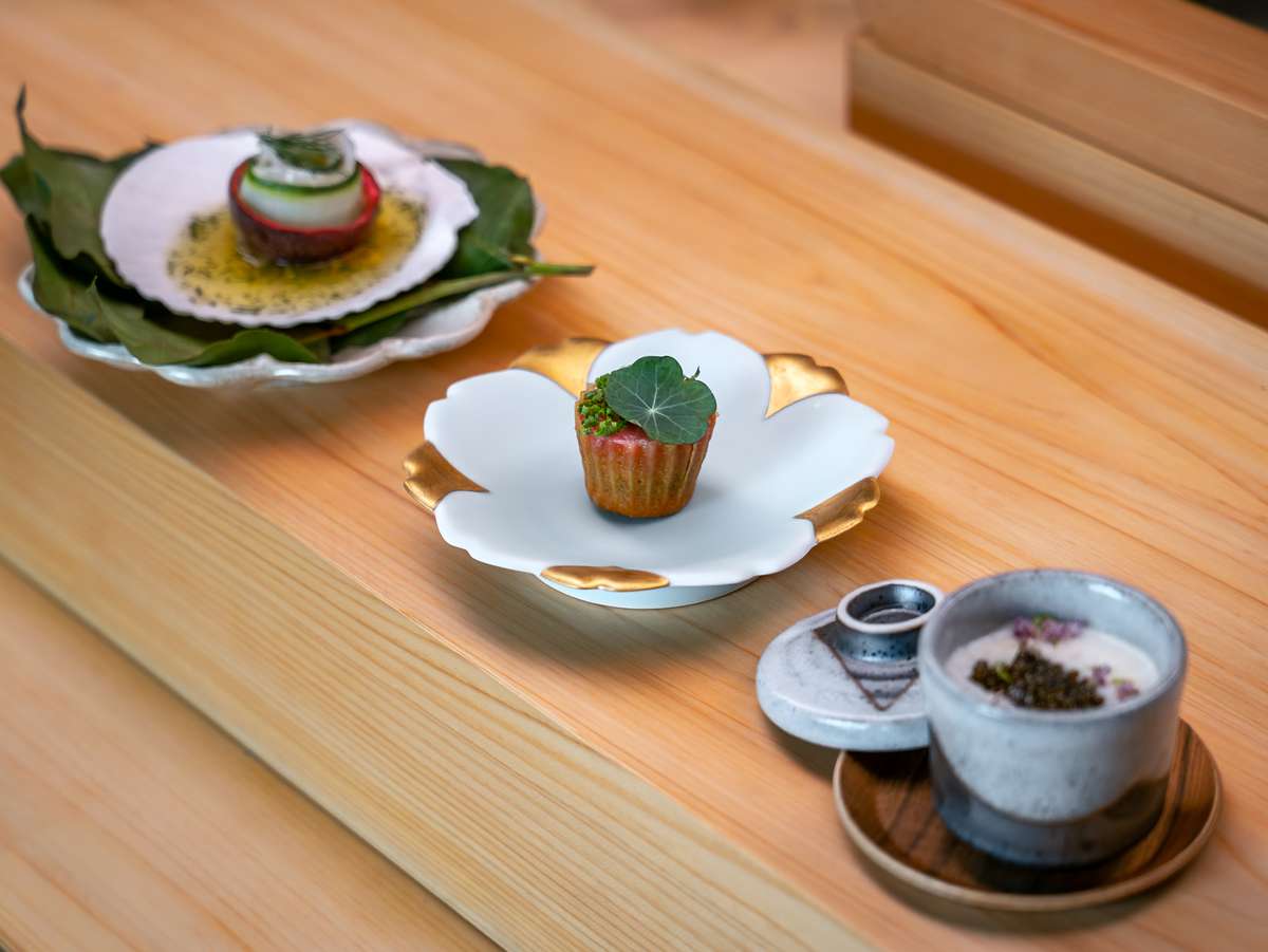 Blue Ribbon Sushi omakase spread featuring premium nigiri, seared Wagyu with egg yolk and Japanese small plates in Pacific Palisades