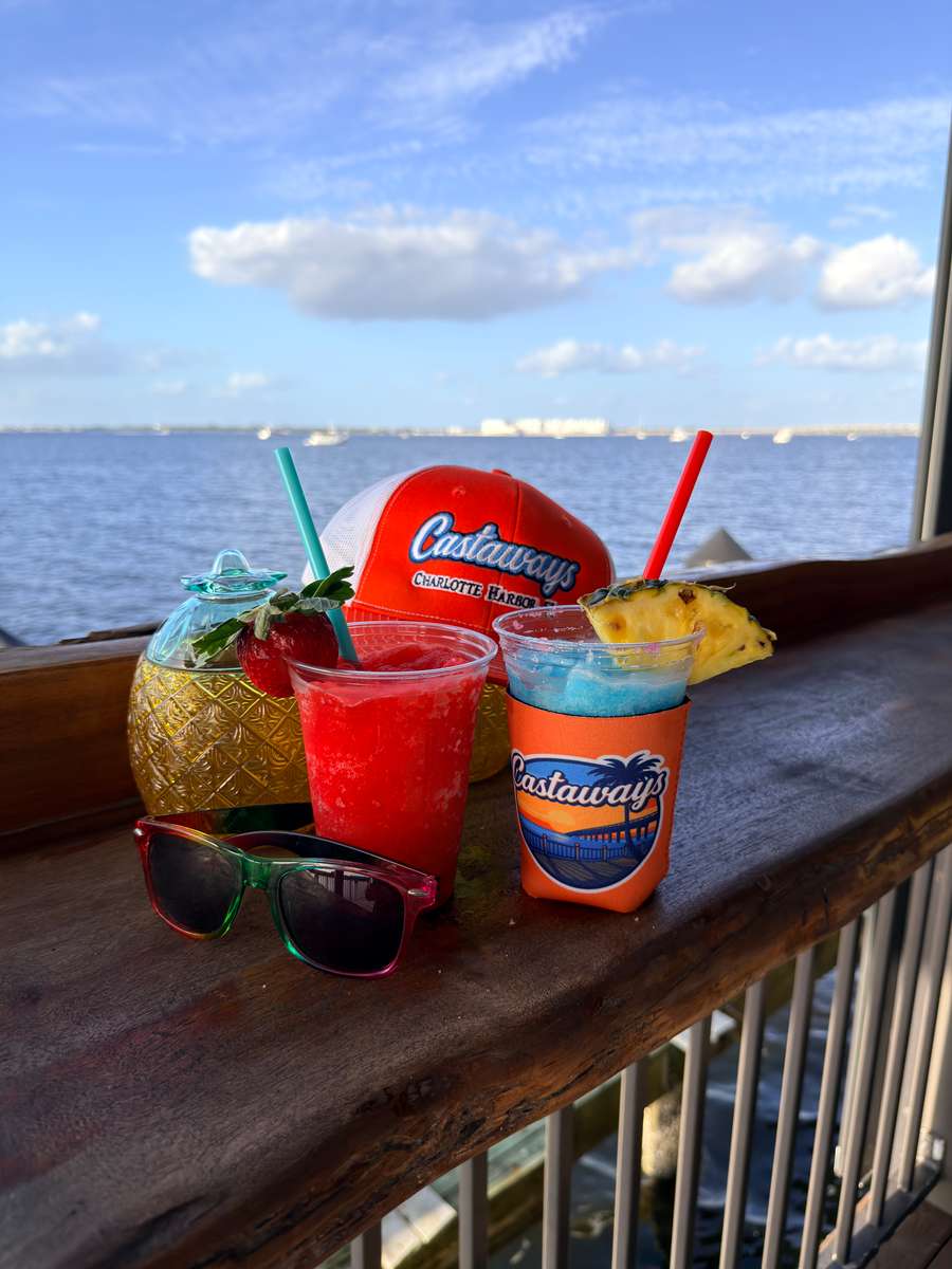 drinks and merchandise in front of water