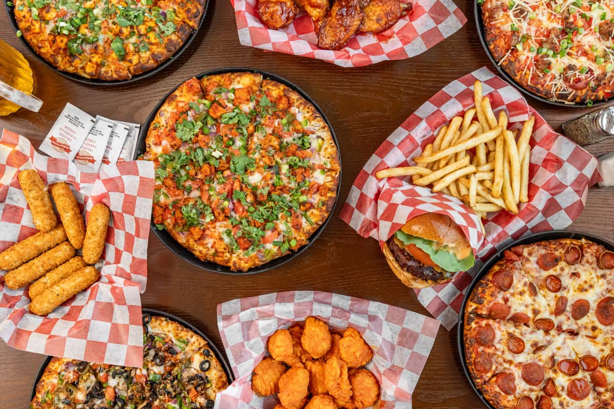 A variety of dishes on a table from Jack's Pizza