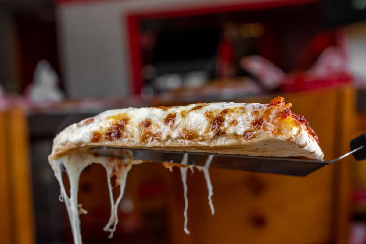 Pizza slice on a spatula