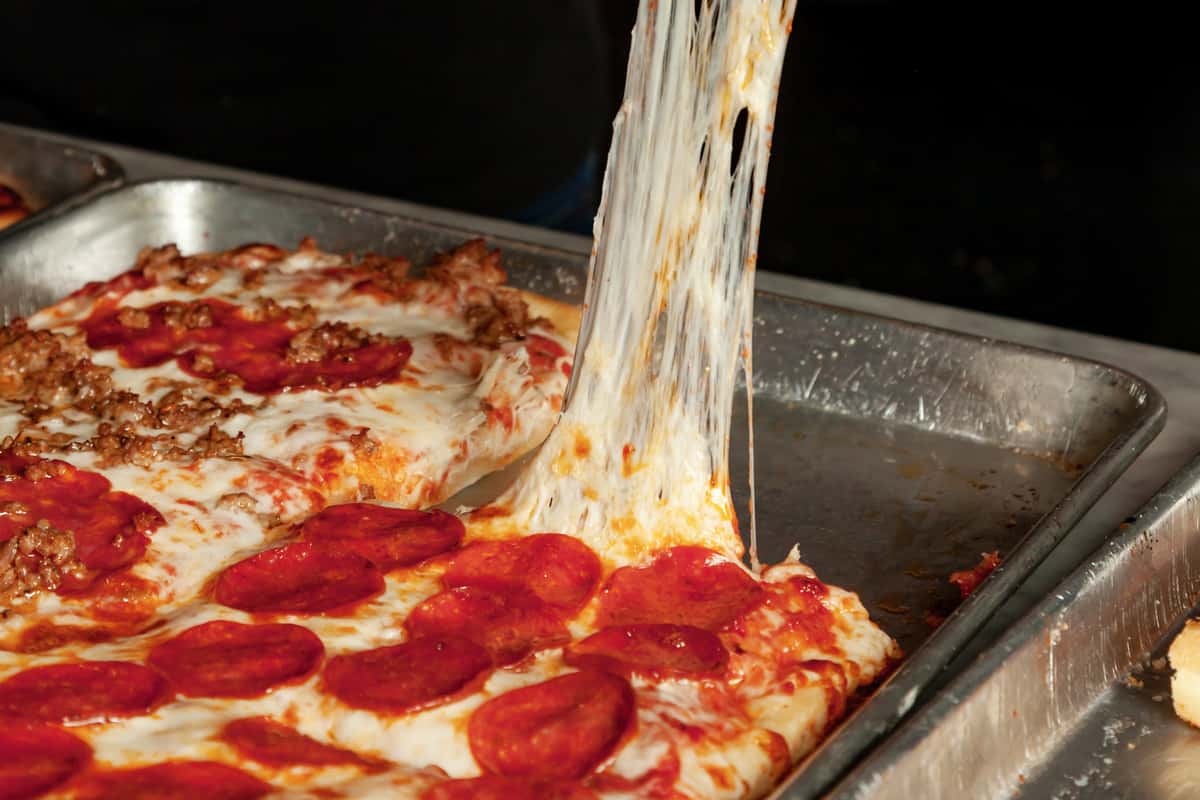 picking up pizza slice