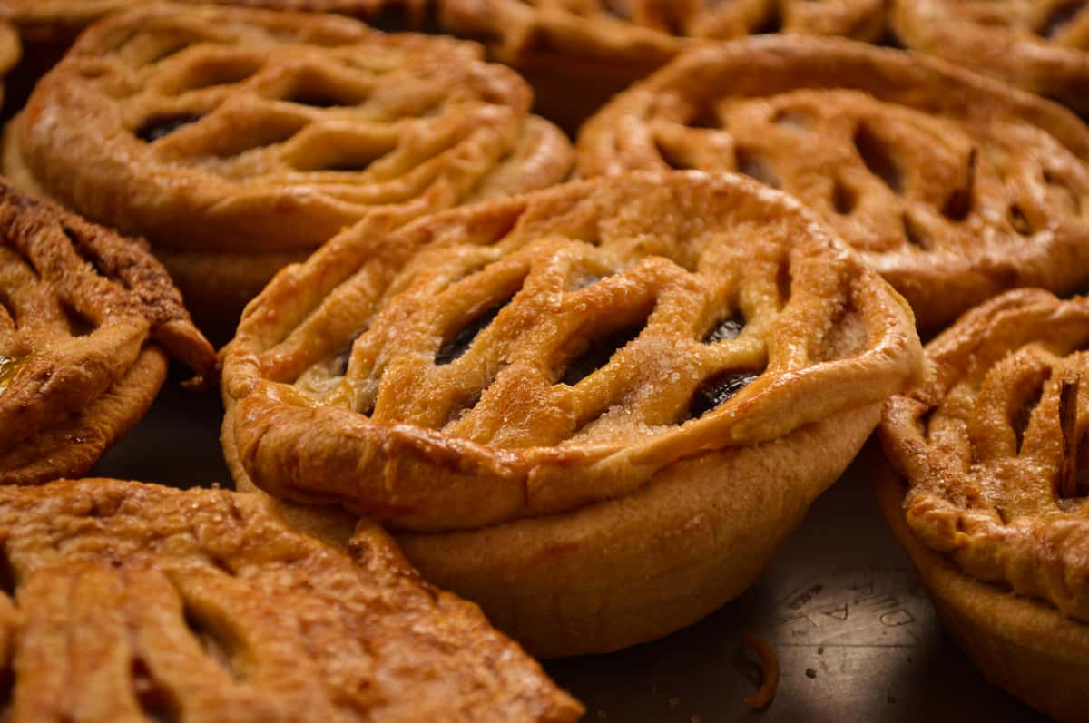 Golden brown lattice-top pastries with sugar sprinkles from The Sunflower Bakery Café.