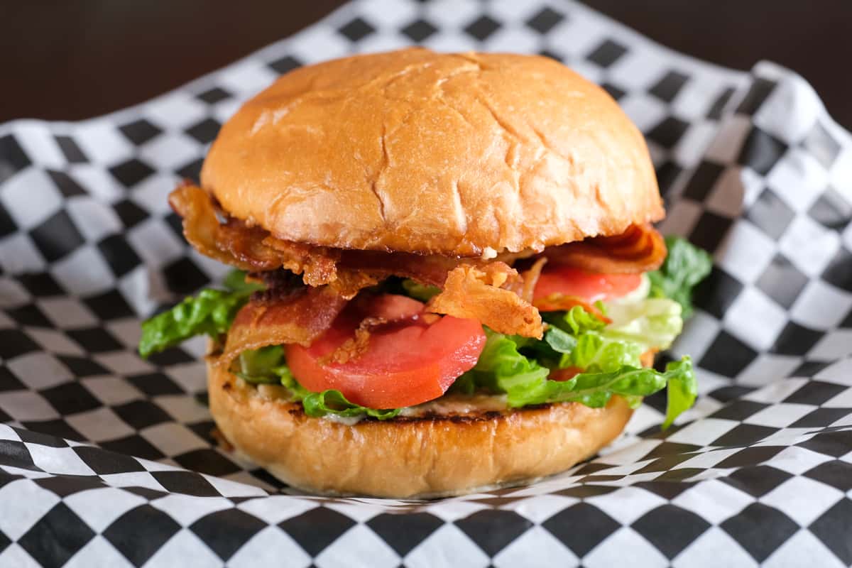 Crispy, thick-cut bacon layered with fresh lettuce and ripe, juicy tomato on toasted artisan bun, with creamy garlic mayo for the perfect balance of crunch and flavor. A timeless favorite done right!