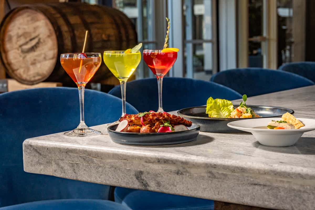 Small plates of food and drinks on a table