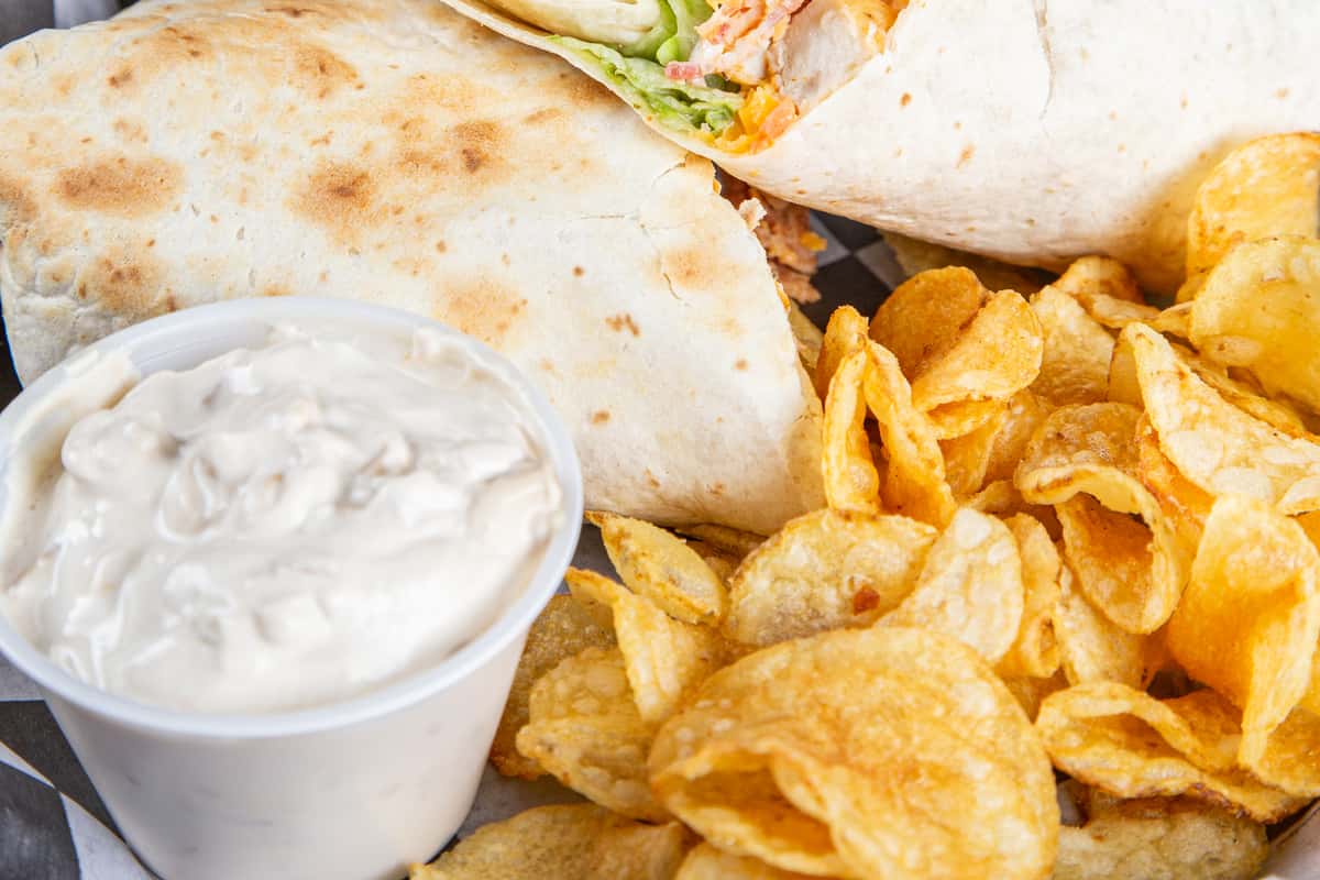 Chicken bacon ranch wrap with kettle chips and ranch dipping sauce at Wisco Coffee Company