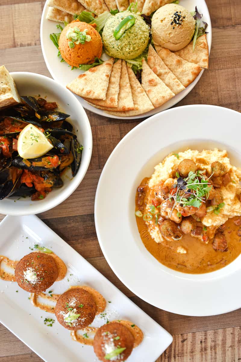 Shrimp and Grits, Hummus Trio, Creole Mussels, Boudin Balls
