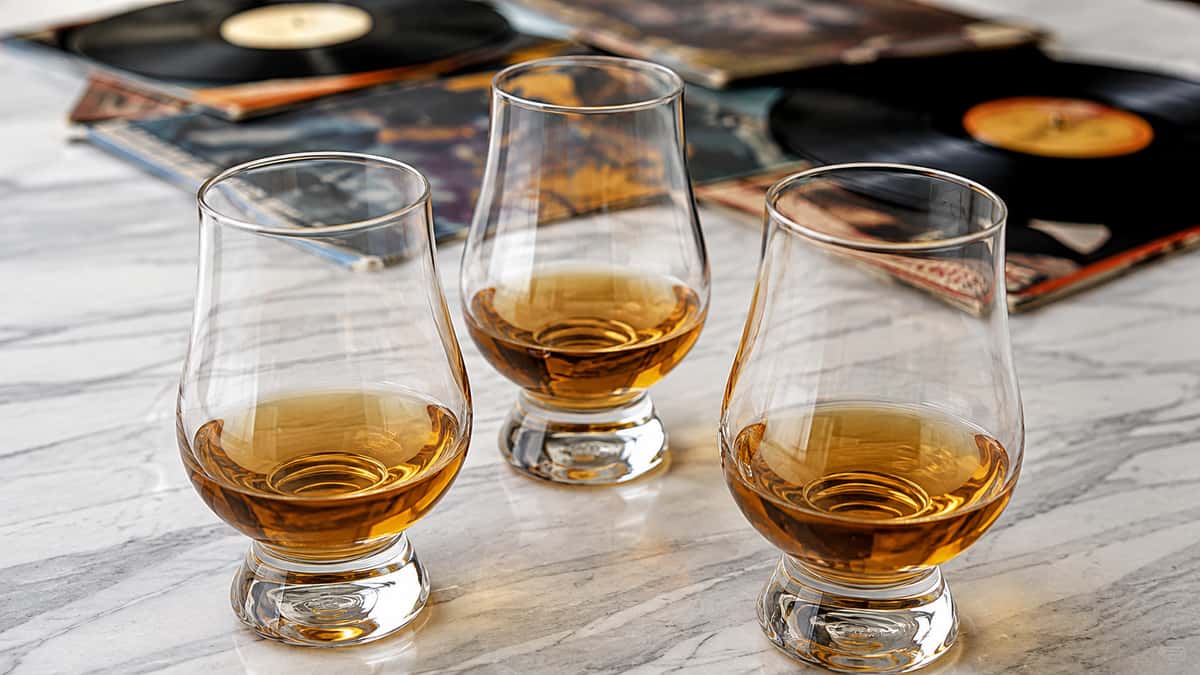 Whiskey tasting glasses with vinyl records and album covers