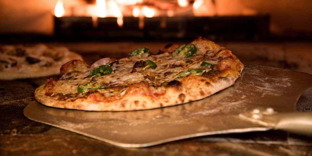 Fresh pizza in a fire ovem