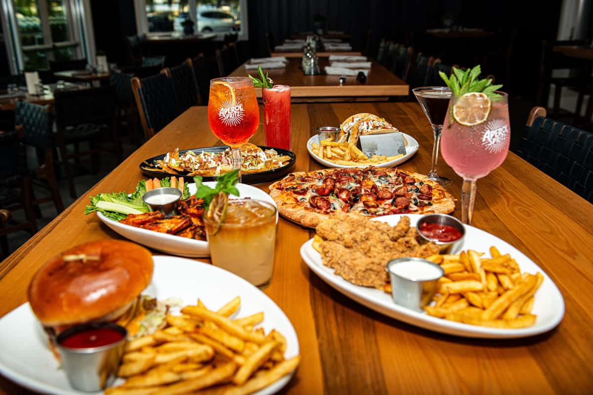 Burgers, wings, pizza, fries and handcrafted cocktails at Fin & Tonic, Sarasota's elevated sports bar — September 2026 professional photo shoot