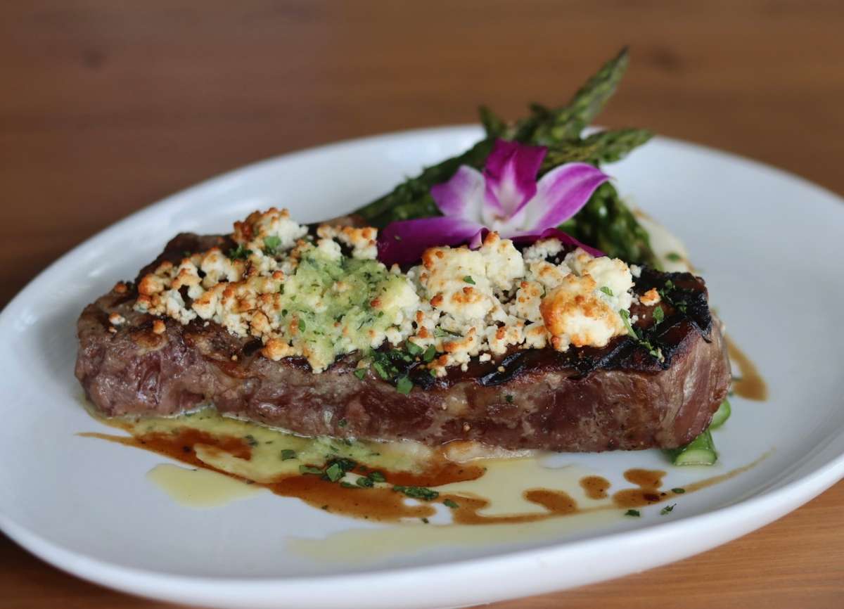 Boursin cheese crust, Black pepper demi glaze, asparagus, mashed potatoes