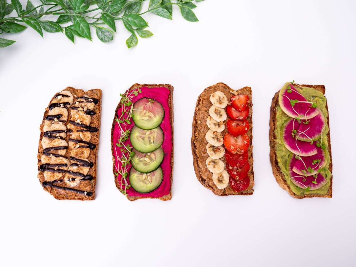 Toasts with nut butters and sliced fruit on top