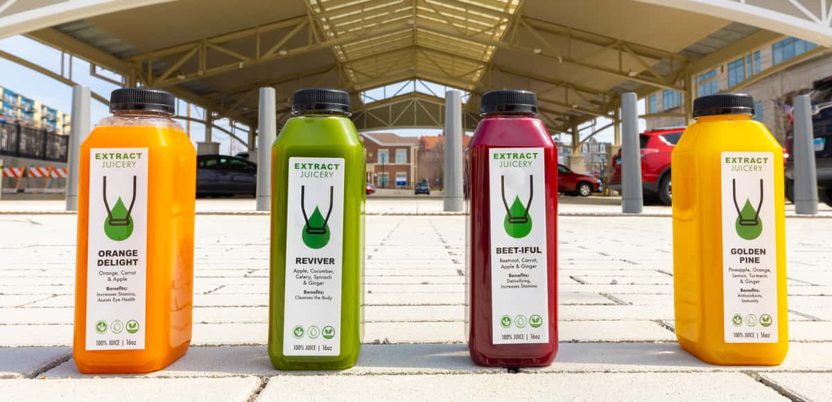 Four Extract Juicery juice bottles