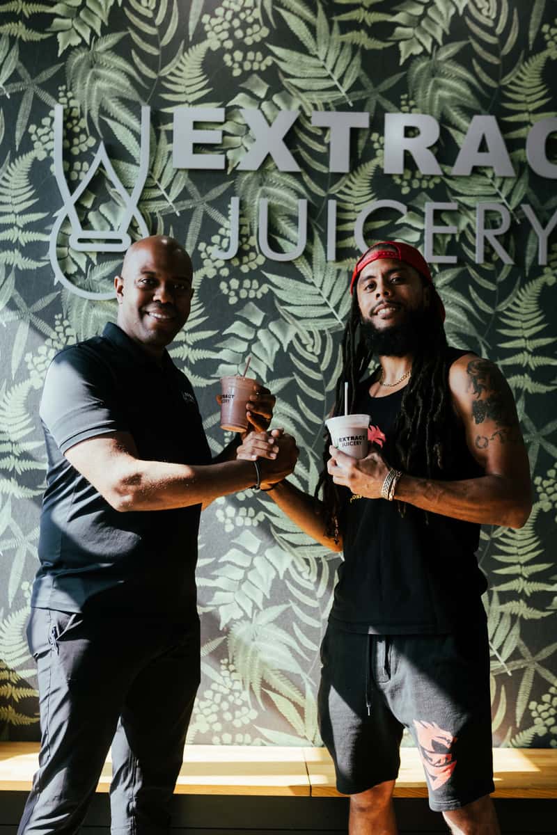 Two customers enjoying drinks at Extract Juicery