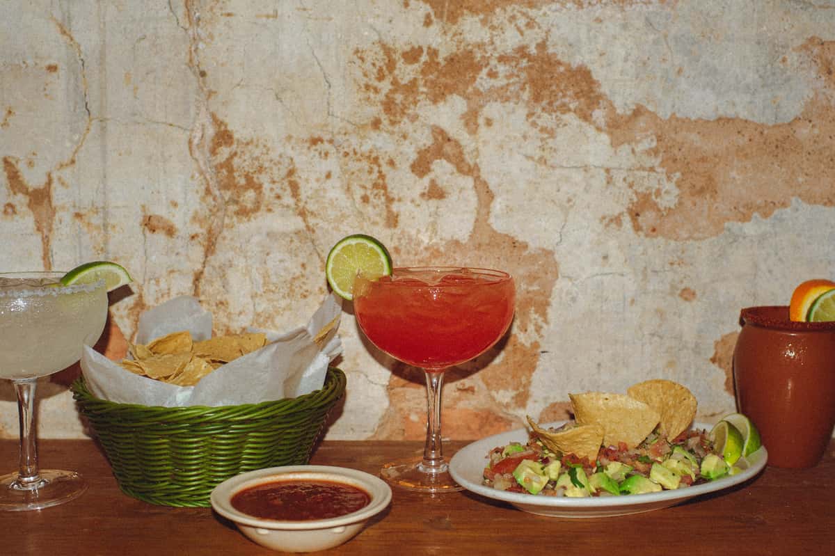 Picture of red drink and food on a table