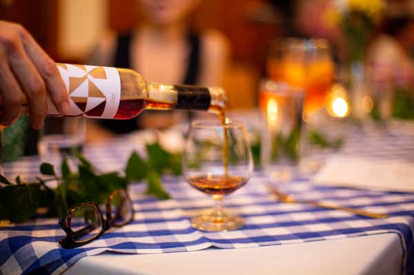 Wine being poured into glasses