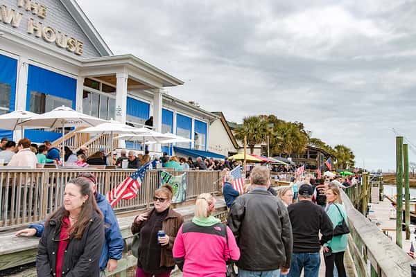 Busy outdoor pier infront of the Claw House