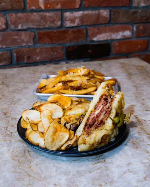 The Brewdain, focaccia, seared mortadella, swiss cheese, may, house mustard, served with homemade house chips or french fries