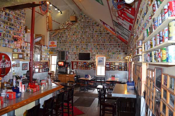 Inside view of the business with no customers and tables are set.