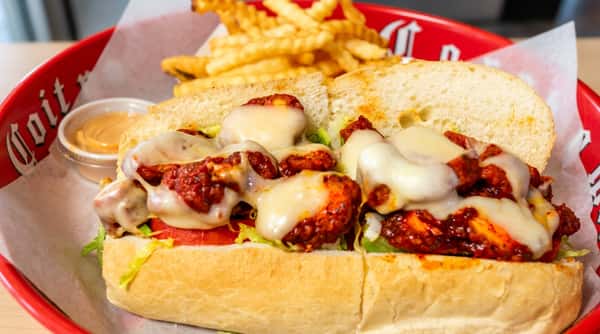Toasted sub with melted cheese and fries