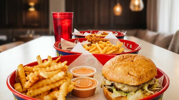 Table spread with burger, chicken tenders and fries