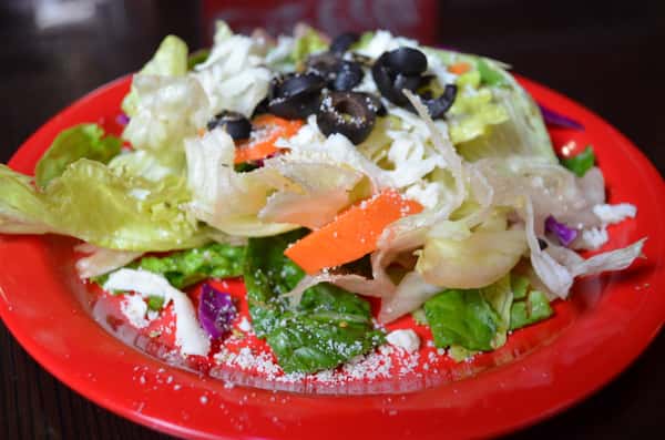 Dinner Salad. Iceberg lettuce, romaine, red cabbage, carrots, olives, and mozzarella cheese.