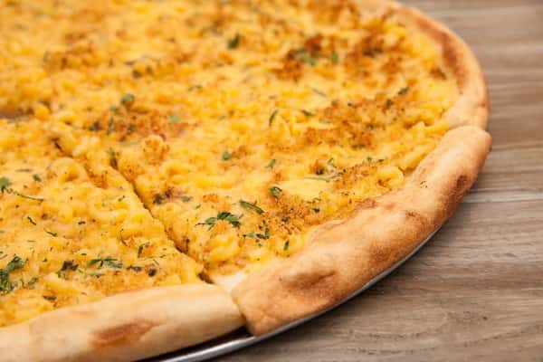 large cheese pizza with herbs