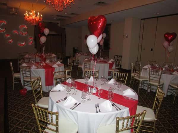 round table decorated with heart-shaped balloons
