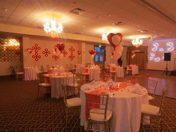 several round tables decorated with balloons