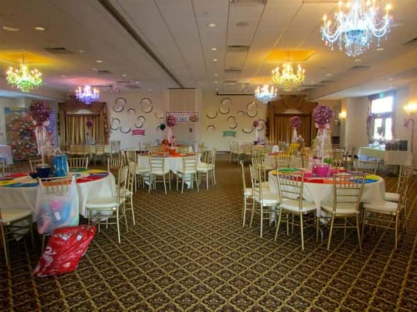 large banquet room with several decorated tables