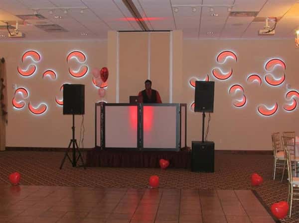 disc jockey between two speakers