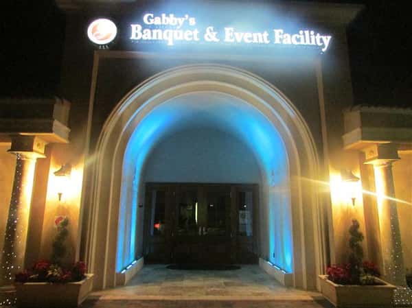 archway with sign above it that reads gabby's banquet & event facility