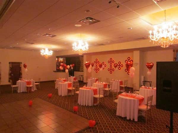 several round tables decorated with balloons