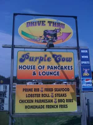 Exterior sign Drive Thru sign with Purple Cow House of Pancakes sign below it.