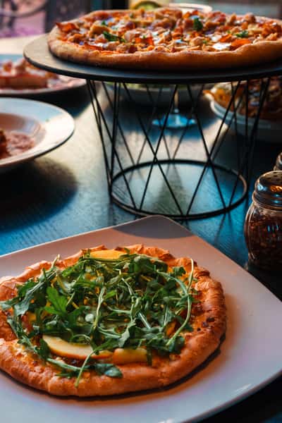 Wood-fired pizza and fresh salad at Oak & Pie in Wichita, KS