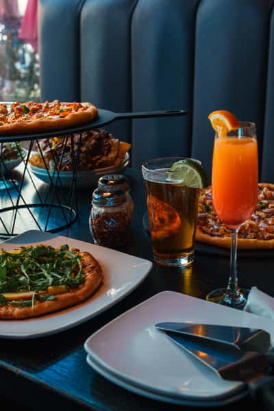 Wood-fired pizza, fresh salad, and drinks at Oak & Pie in Wichita, KS
