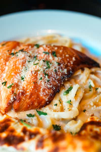 Fresh salmon served over pasta at Oak & Pie in Wichita, KS
