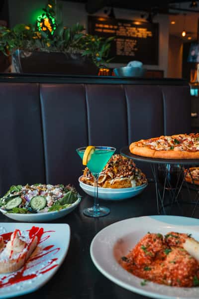Pizza, salad, and pasta spread at Oak & Pie in Wichita, KS