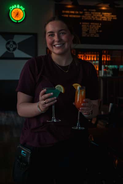 Friendly Oak & Pie team member serving handcrafted drinks in Wichita, KS