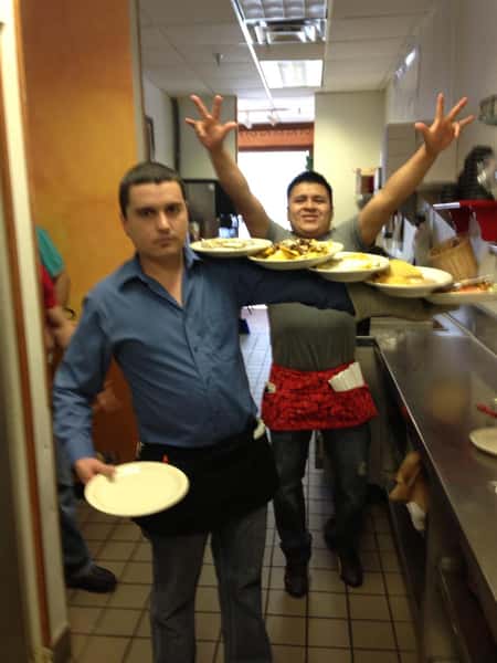 two employees posing for a photo