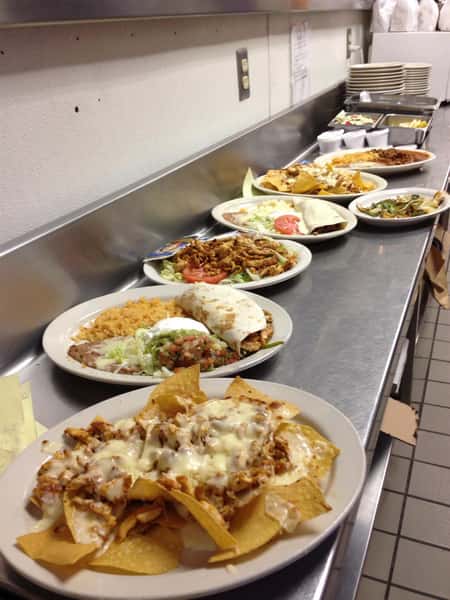 assortment of dishes lined up in the kitchen