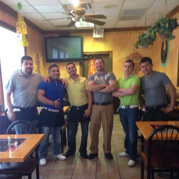 employees posing for a photo