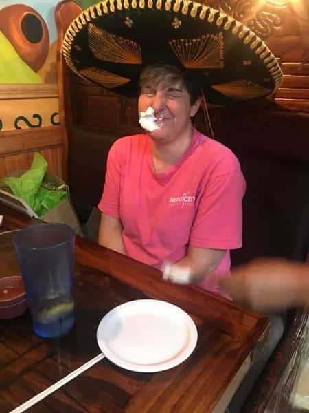 woman with whippee cream on her face