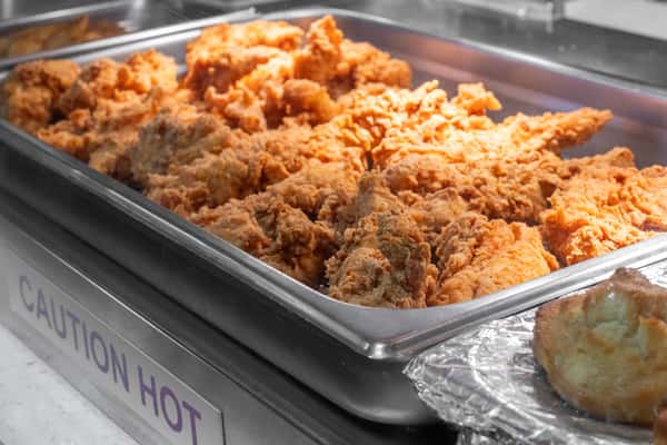 Close-up of prepared fried food displayed inside the restaurant.