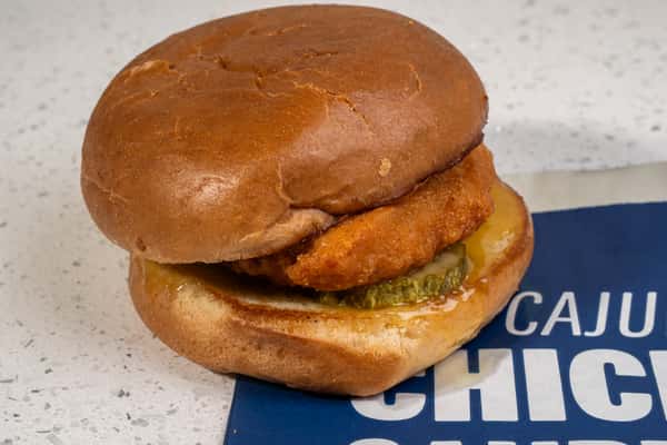 Close-up of a Cajun chicken sandwich on a toasted bun.