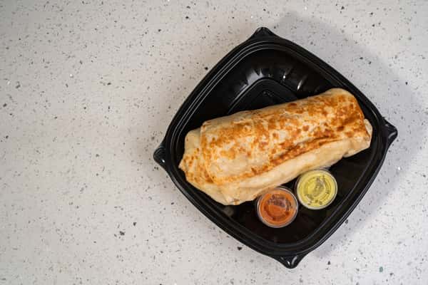 Eagle Nest burrito served in a black takeout tray with dipping sauces.