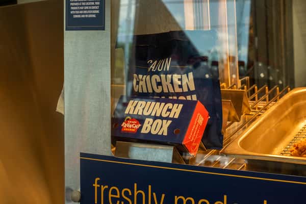 Interior detail featuring a Cajun chicken sandwich promotional sign near the food counter.