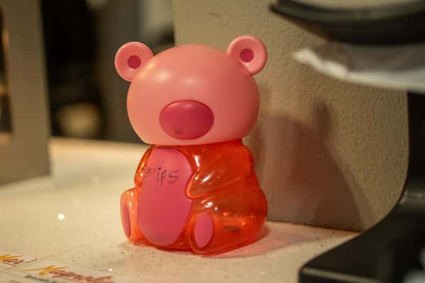 Close-up of a pink bear-shaped decorative figure inside the restaurant.